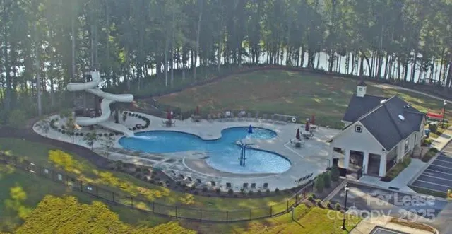 a view of a lake with large trees