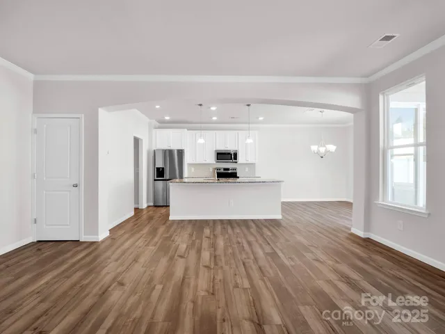 a view of kitchen and wooden floor