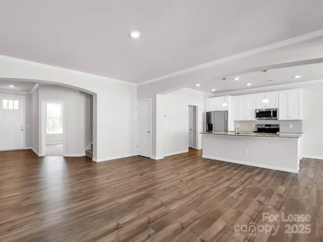 a view of kitchen with stainless steel appliances kitchen island