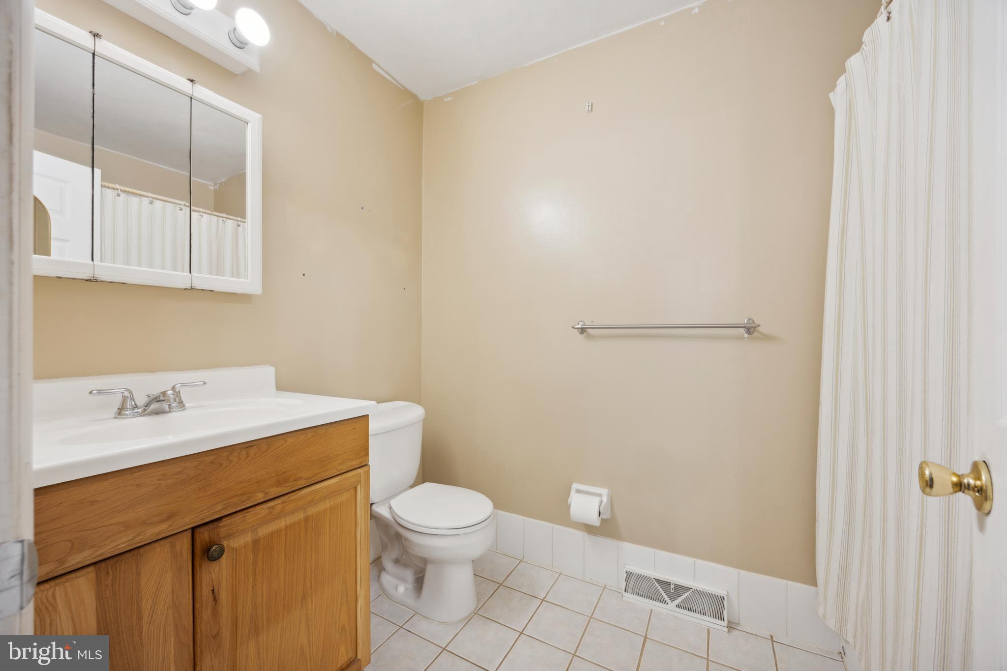 105 Grant Road Lansdale, PA 19446 - Photo 9 of 15 a bathroom with a sink a toilet and vanity