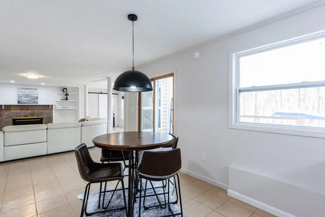a kitchen with stainless steel appliances a sink a stove and cabinets