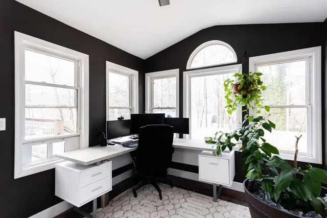 a dining room with furniture and window