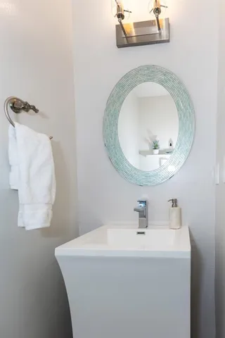 a view of a hallway with wooden floor and closet