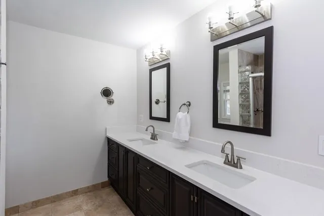 a bathroom with a glass shower door