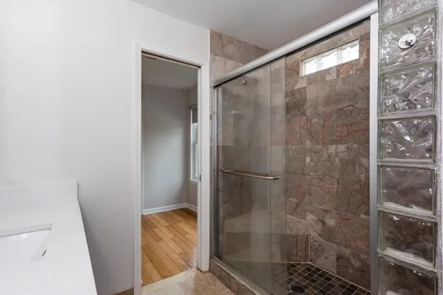 a view of walk in closet with clothes