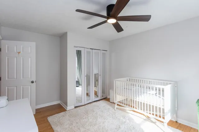 a living room with furniture and a lamp