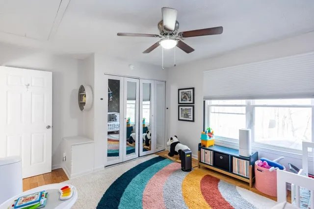 a view of a house with backyard and deck