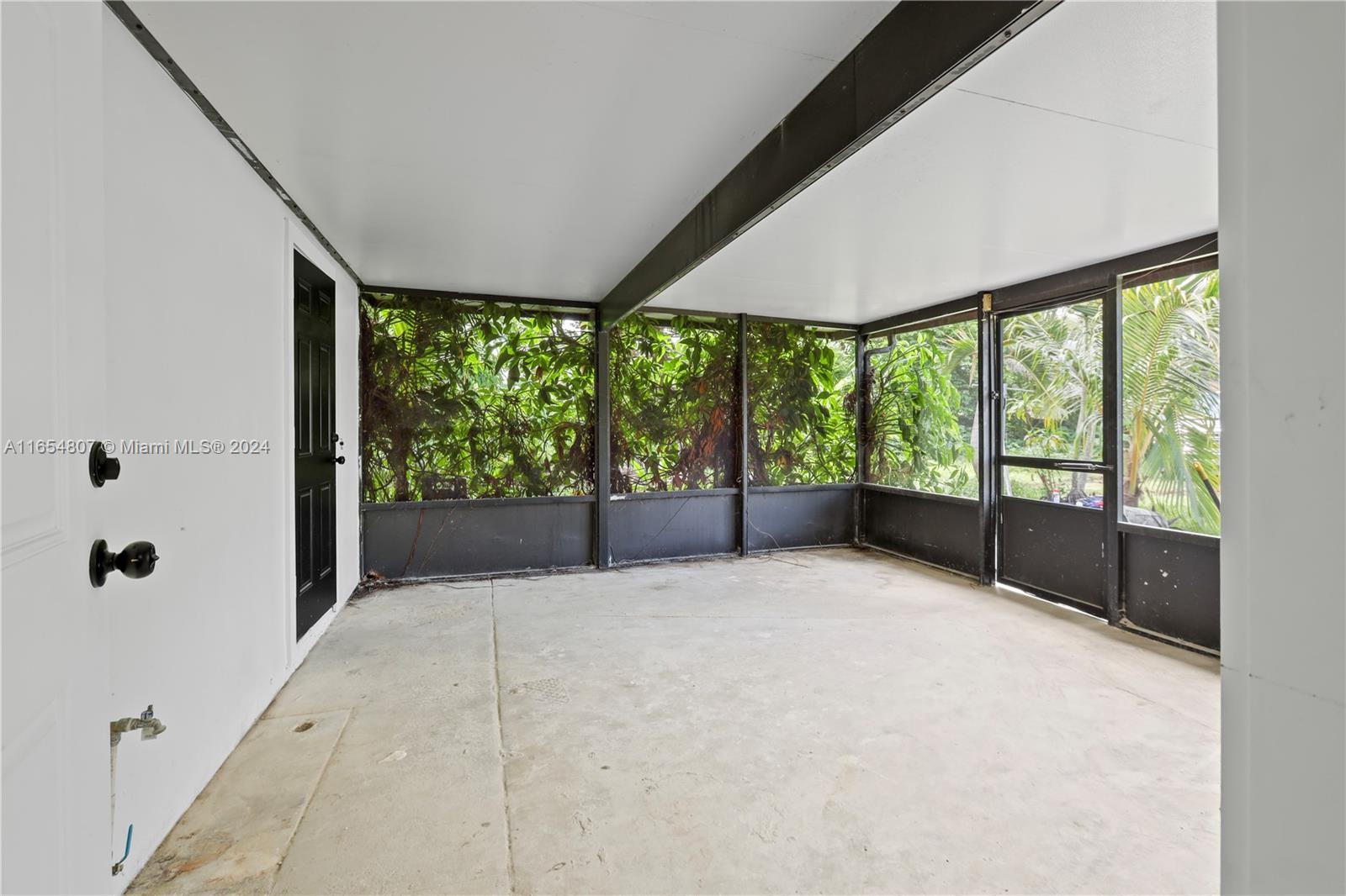 29010 Louisiana Road Homestead, FL 33033 - Photo 12 of 16 a view of an empty room with a large window
