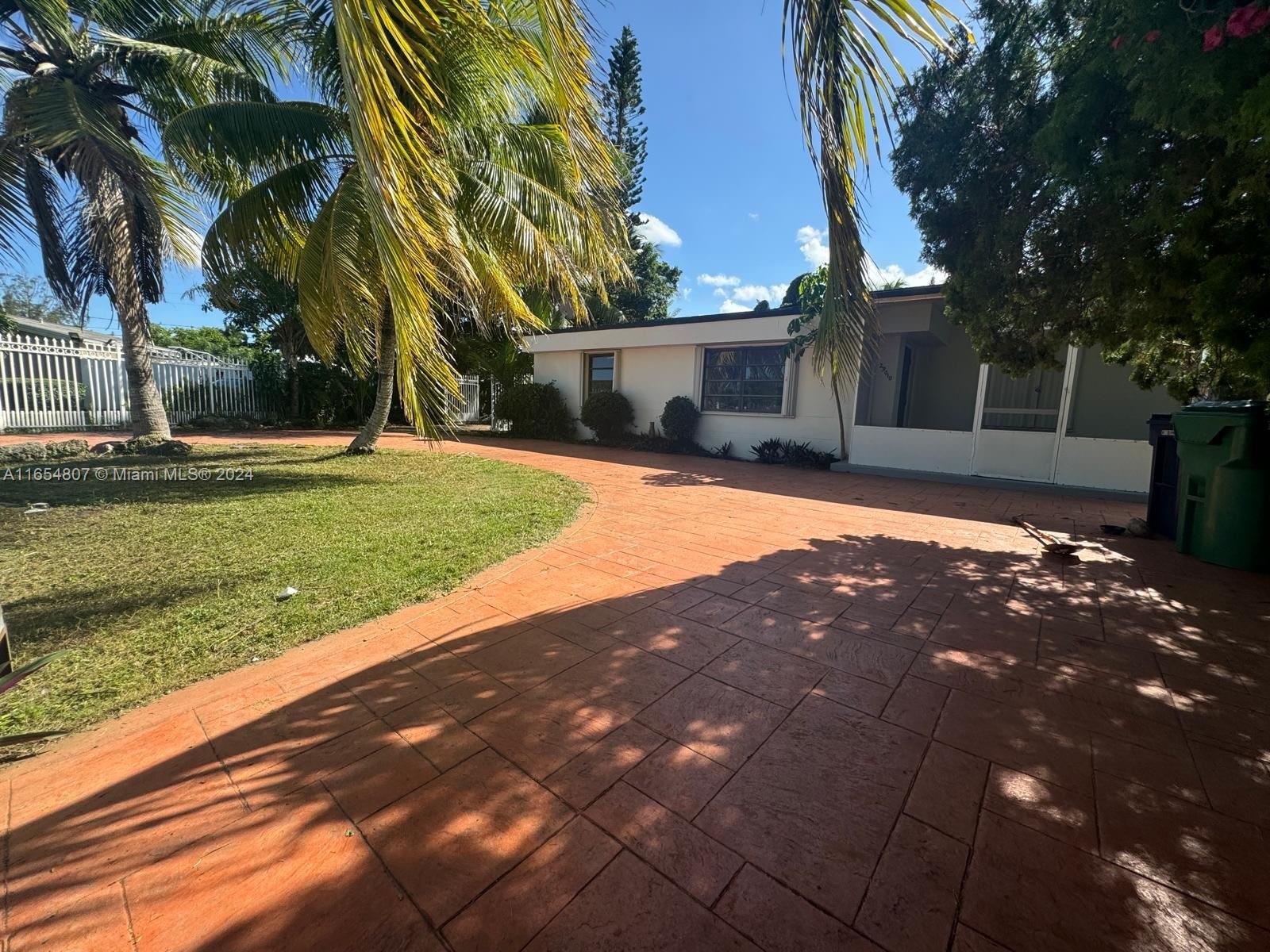 29010 Louisiana Road Homestead, FL 33033 - Photo 16 of 16 a view of a backyard with a garden