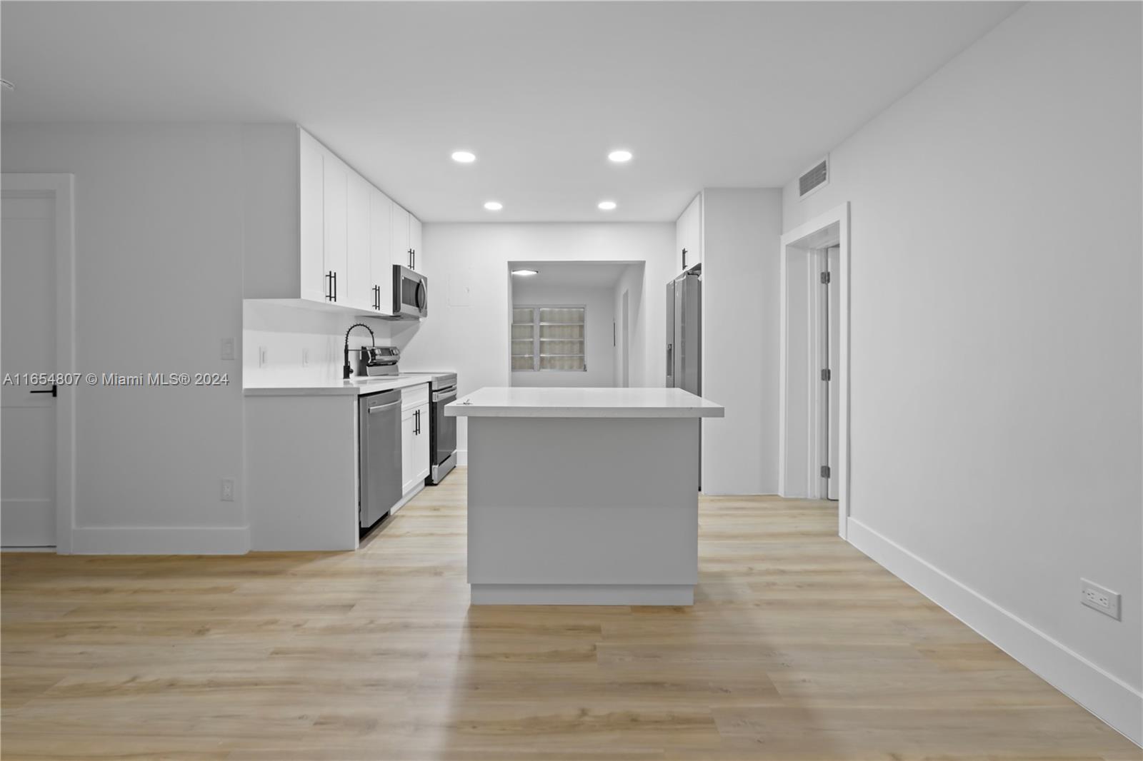 29010 Louisiana Road Homestead, FL 33033 - Photo 4 of 16 a view of kitchen with wooden floor