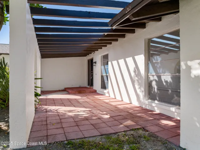 a kitchen with a sink and large window