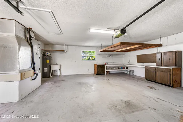 a bathroom with a glass shower door and a mirror