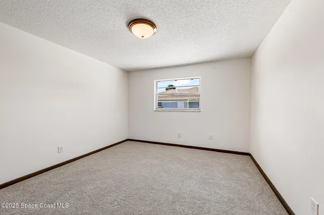 a kitchen with a refrigerator and countertop