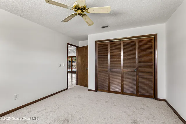 a view of a porch with wooden floor and fence