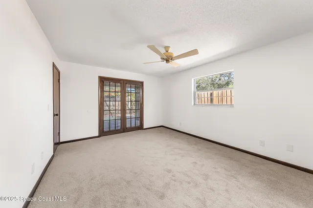 a view of a backyard with a swimming pool