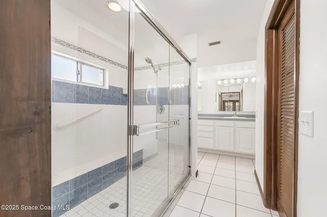 an aerial view of a house with outdoor space