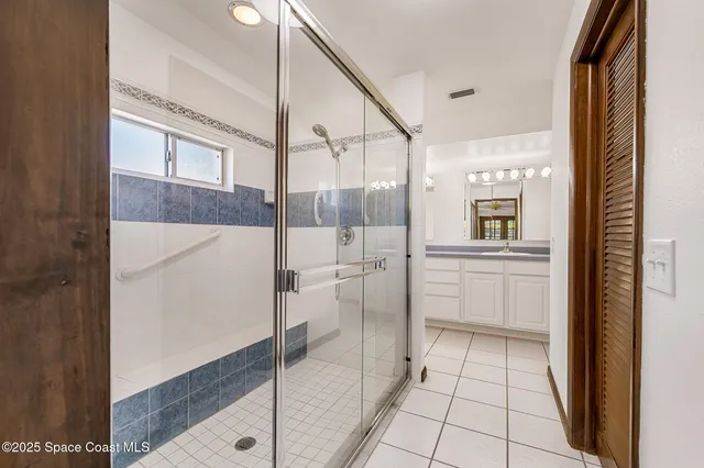 an aerial view of residential building and ocean