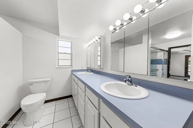 a front view of a house with a yard garage and outdoor seating