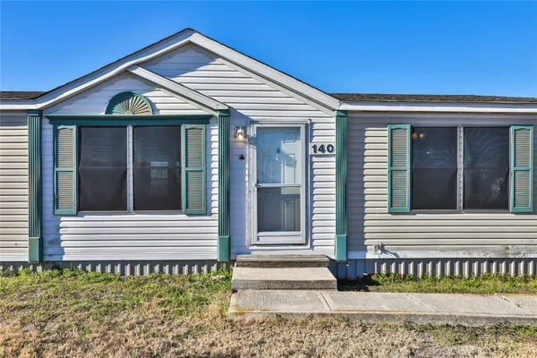 a front view of a house with a porch