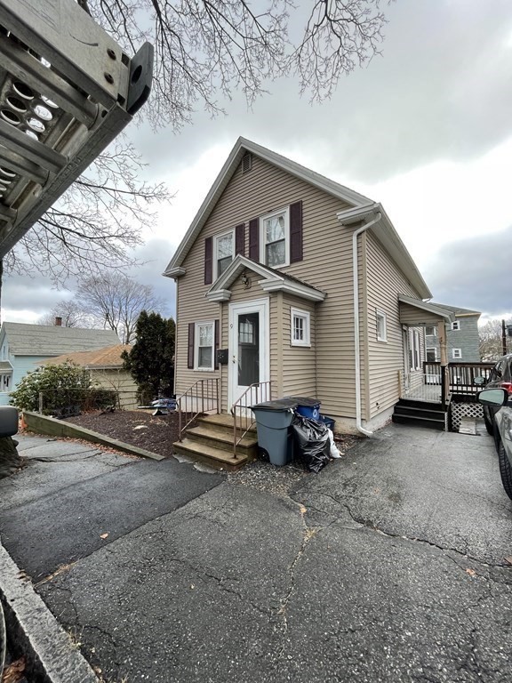 9 Thayer Street Worcester, MA 01603 - Photo 1 of 18 a view of a house with backyard and parking area