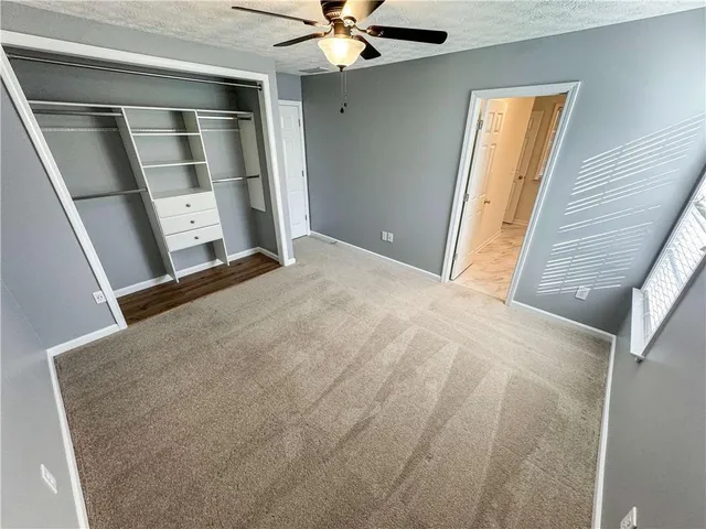 a view of swimming pool with wooden fence