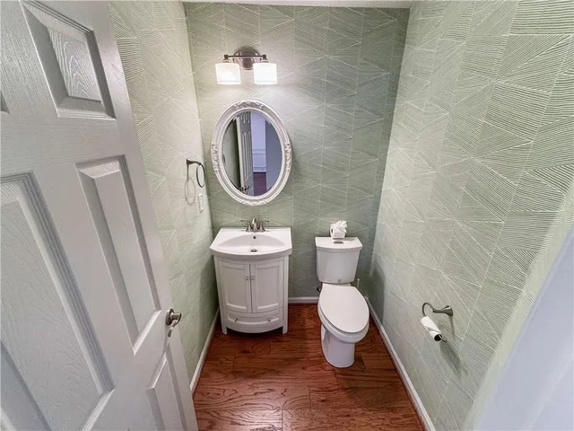 a bathroom with a toilet and a sink