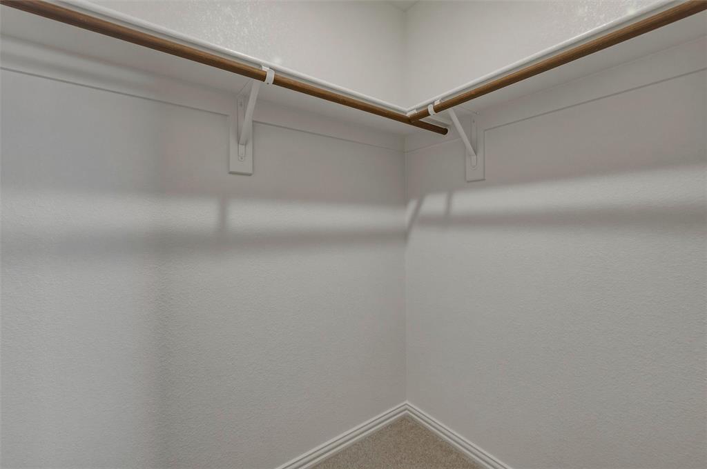 1337 Frio Drive Springtown, TX 76082 - Photo 25 of 40 Built-in wood-finish hanging rods with white supports