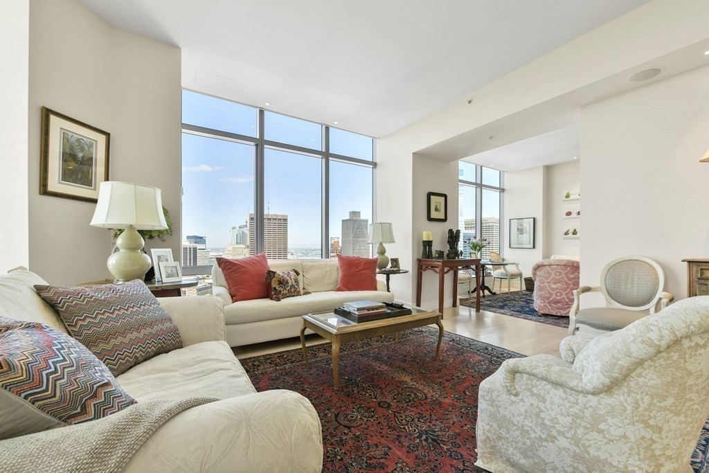 1 Avery Street, Unit PH1A Boston, MA 02111 - Photo 13 of 29 a living room with furniture and a large window