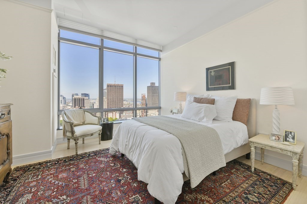 1 Avery Street, Unit PH1A Boston, MA 02111 - Photo 21 of 29 a bedroom with a bed and a couch