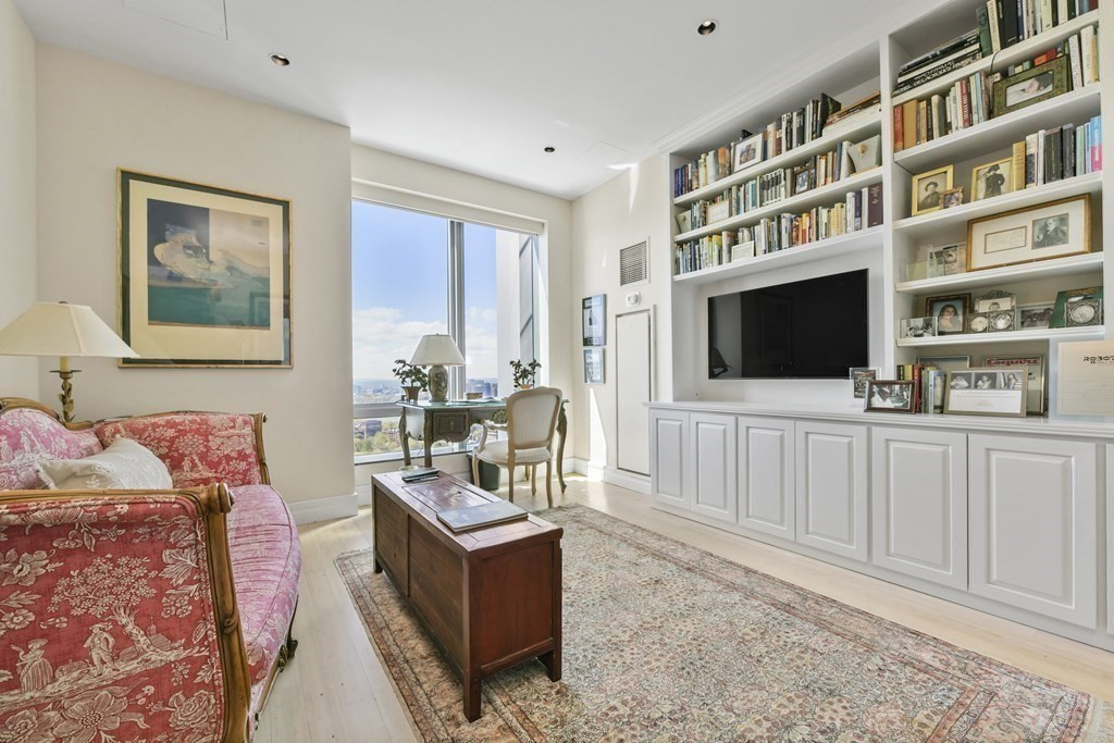 1 Avery Street, Unit PH1A Boston, MA 02111 - Photo 22 of 29 a living room with furniture and a flat screen tv