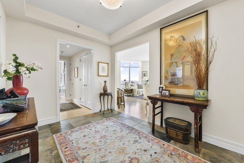 1 Avery Street, Unit PH1A Boston, MA 02111 - Photo 23 of 29 a living room with furniture and a table