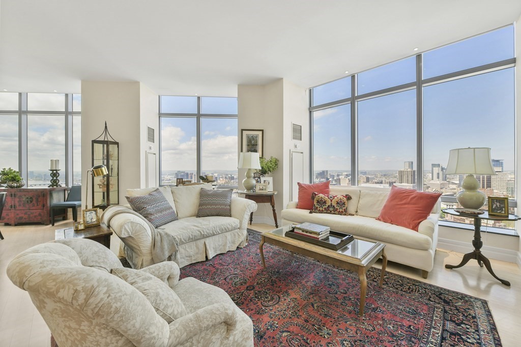 1 Avery Street, Unit PH1A Boston, MA 02111 - Photo 3 of 29 a living room with furniture and a large window