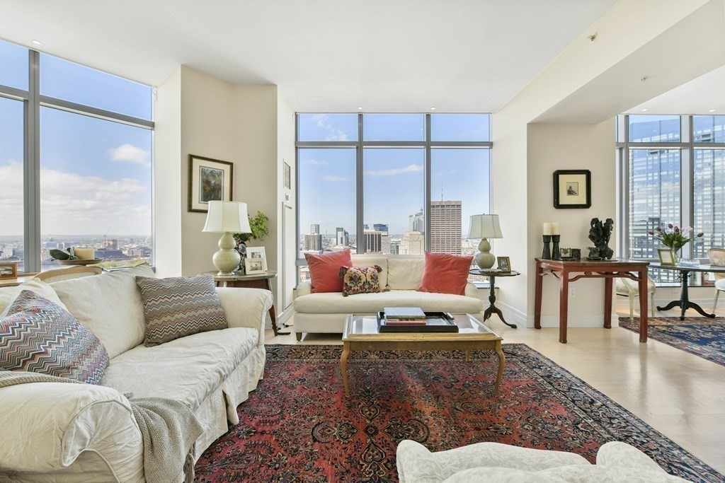 1 Avery Street, Unit PH1A Boston, MA 02111 - Photo 6 of 29 a living room with furniture and a large window