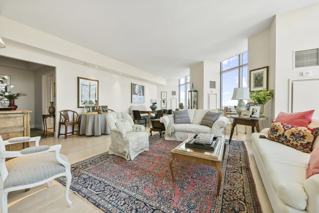1 Avery Street, Unit PH1A Boston, MA 02111 - Photo 7 of 29 a living room with furniture and a table
