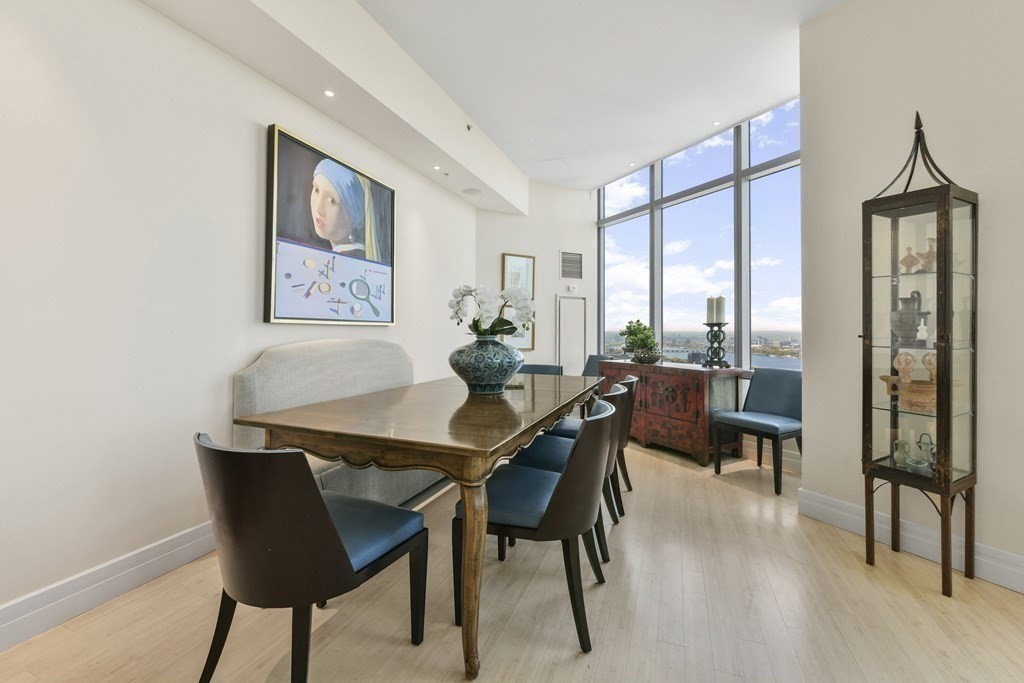 1 Avery Street, Unit PH1A Boston, MA 02111 - Photo 9 of 29 a view of a dining room with furniture and a potted plant