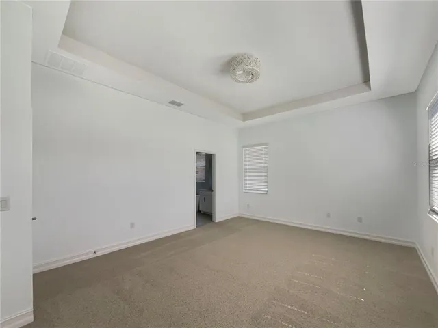 an empty room with a empty space and window