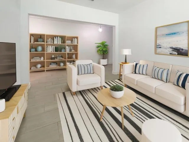 a living room with furniture and a flat screen tv