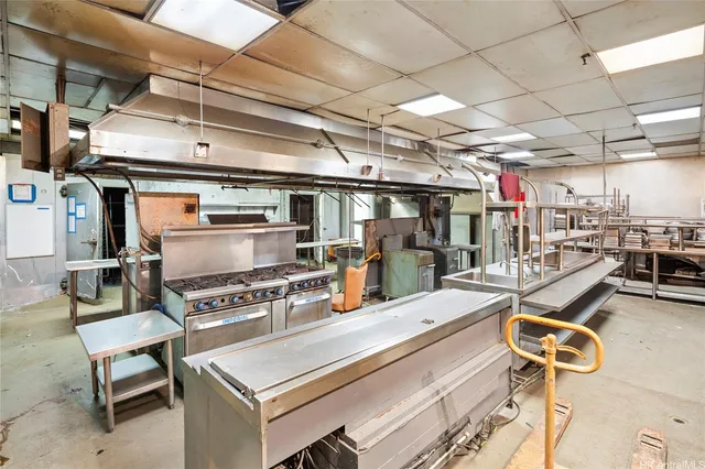 a storage room with washer and lots of appliances