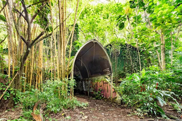 an aerial view of a house with a yard basket ball court and outdoor seating