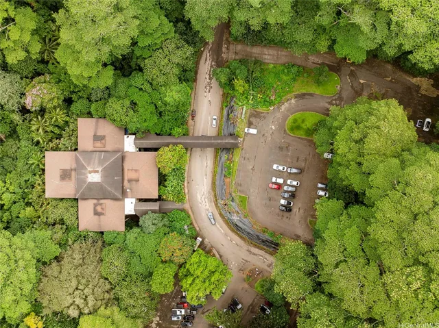 a living room with lots of furniture and a chandelier