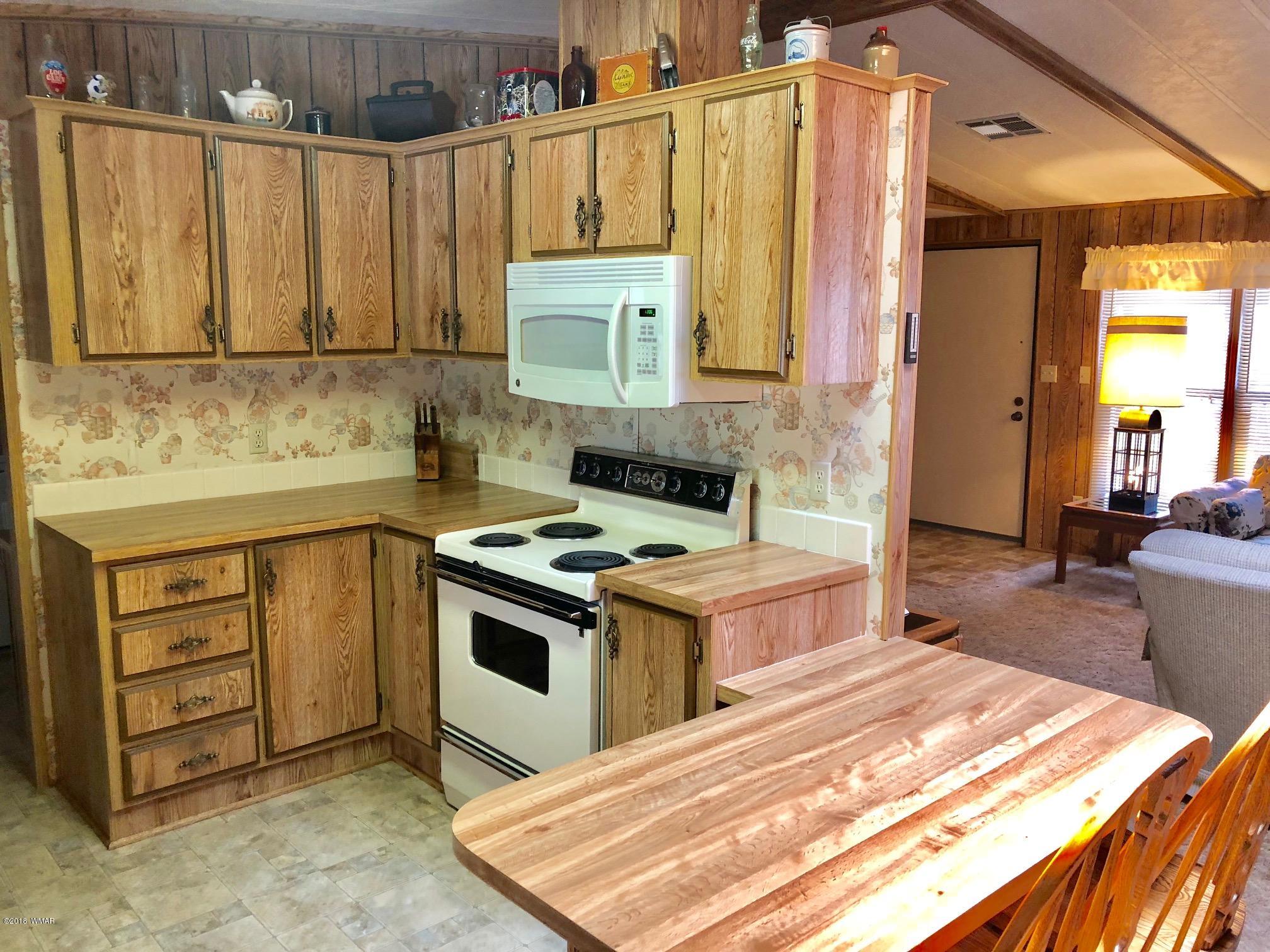 4288 Racoon Court Pinetop, AZ 85935 - Photo 13 of 29 a kitchen with a stove and a sink