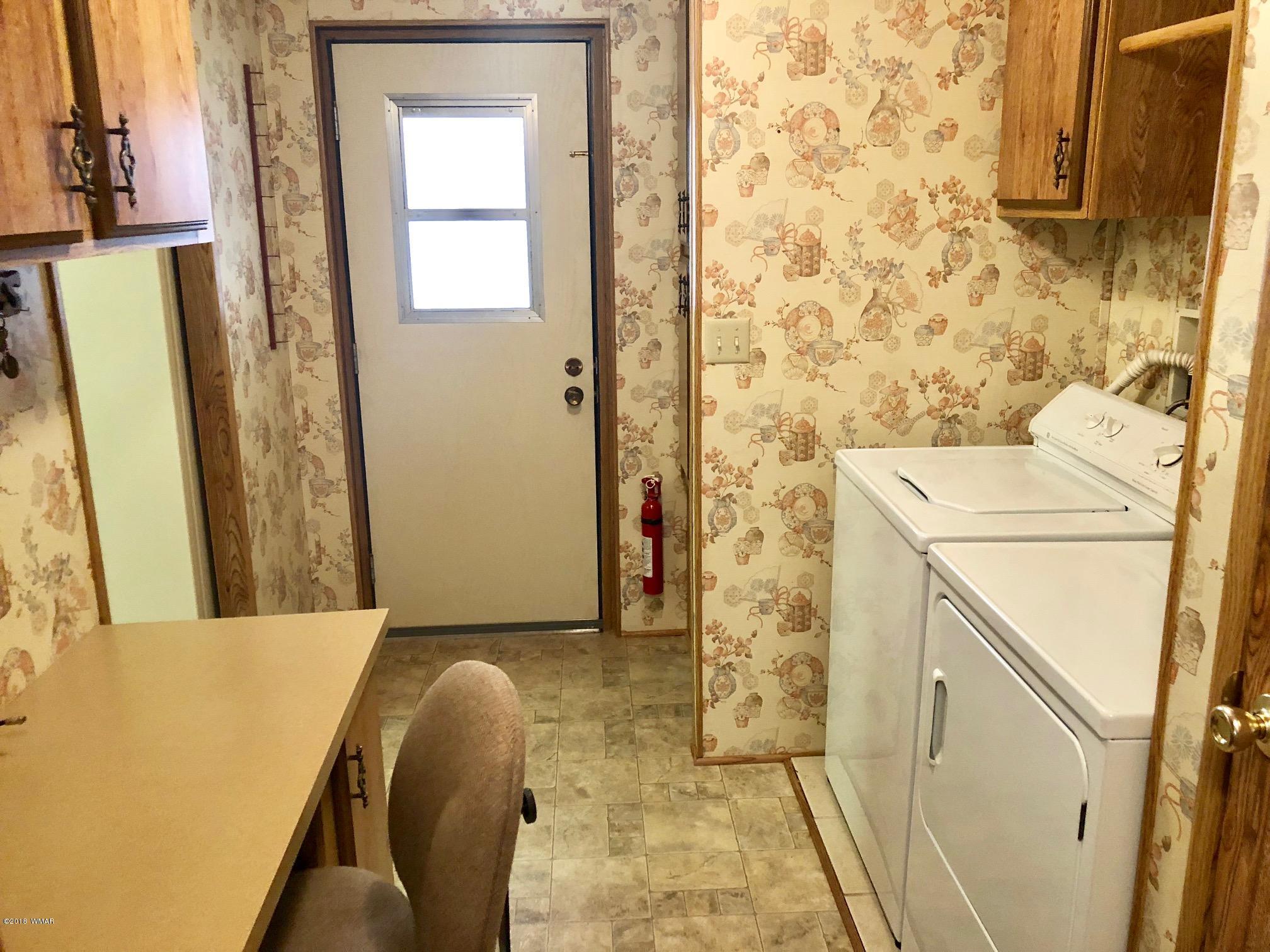 4288 Racoon Court Pinetop, AZ 85935 - Photo 16 of 29 a bathroom with a sink and a mirror
