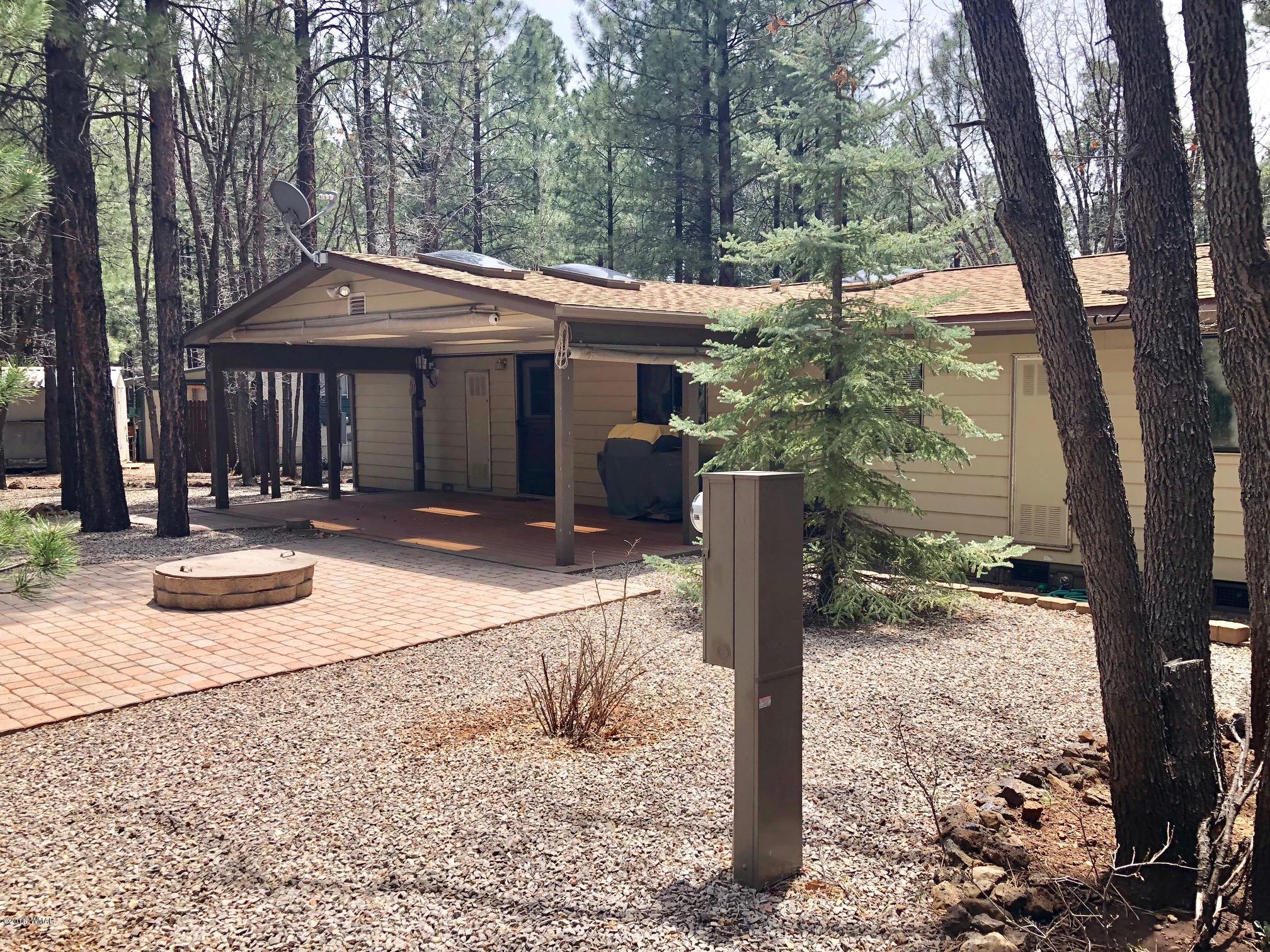 4288 Racoon Court Pinetop, AZ 85935 - Photo 25 of 29 a front view of a house with parking area