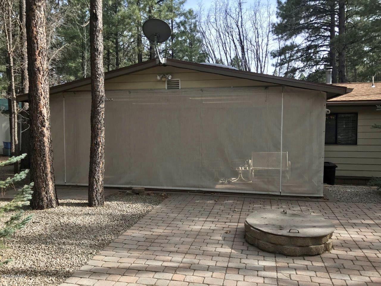 4288 Racoon Court Pinetop, AZ 85935 - Photo 27 of 29 a view of a wooden door of the house