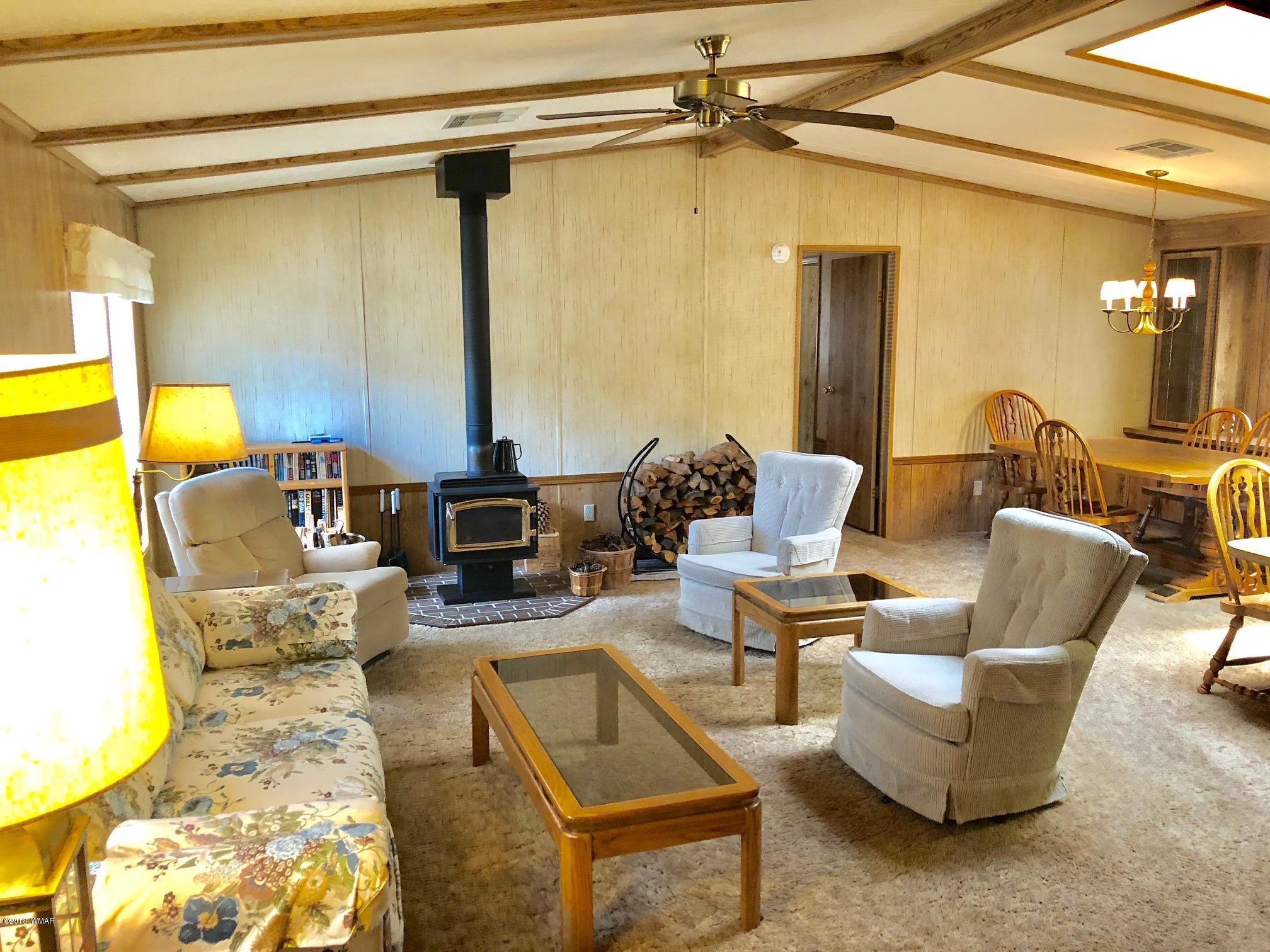 4288 Racoon Court Pinetop, AZ 85935 - Photo 4 of 29 a living room with furniture and a table