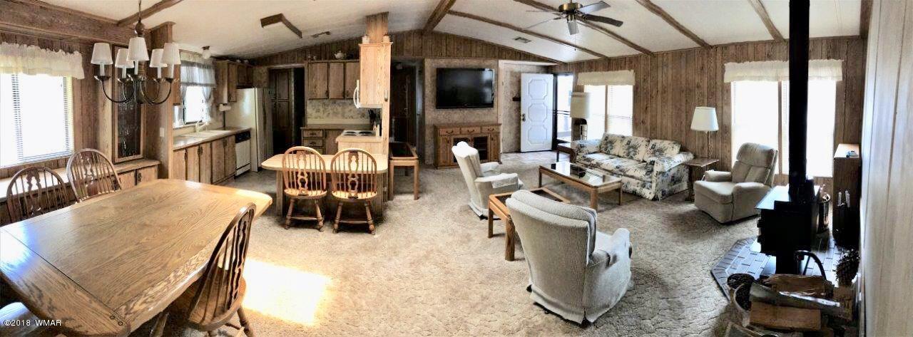 4288 Racoon Court Pinetop, AZ 85935 - Photo 7 of 29 a living room with furniture and a large window