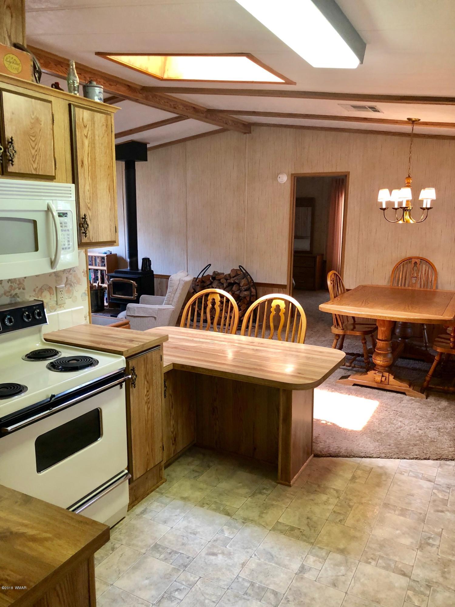 4288 Racoon Court Pinetop, AZ 85935 - Photo 10 of 29 a kitchen that has a sink and a stove