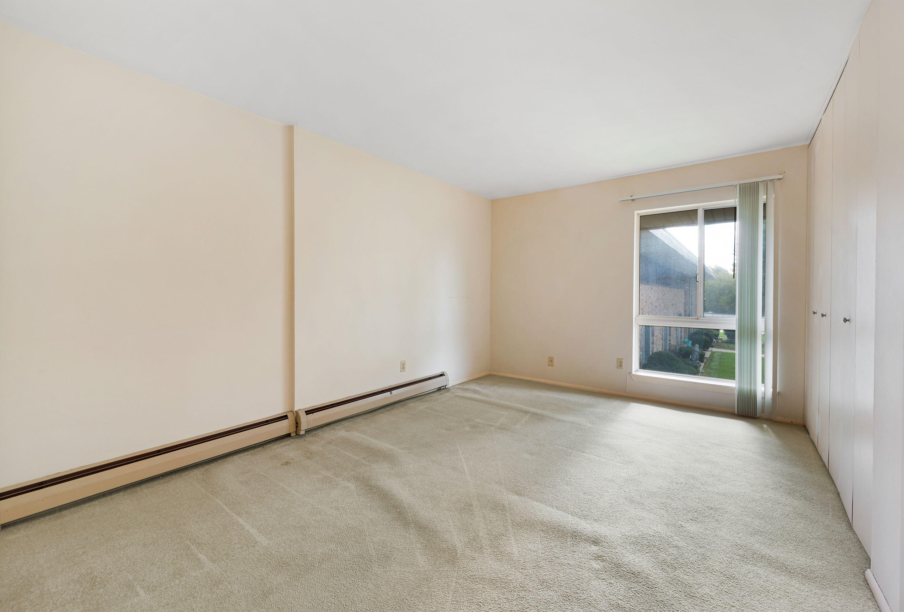 11958 West Mill Road, Unit 19 Milwaukee, WI 53225 - Photo 14 of 30 Spacious Bedroom