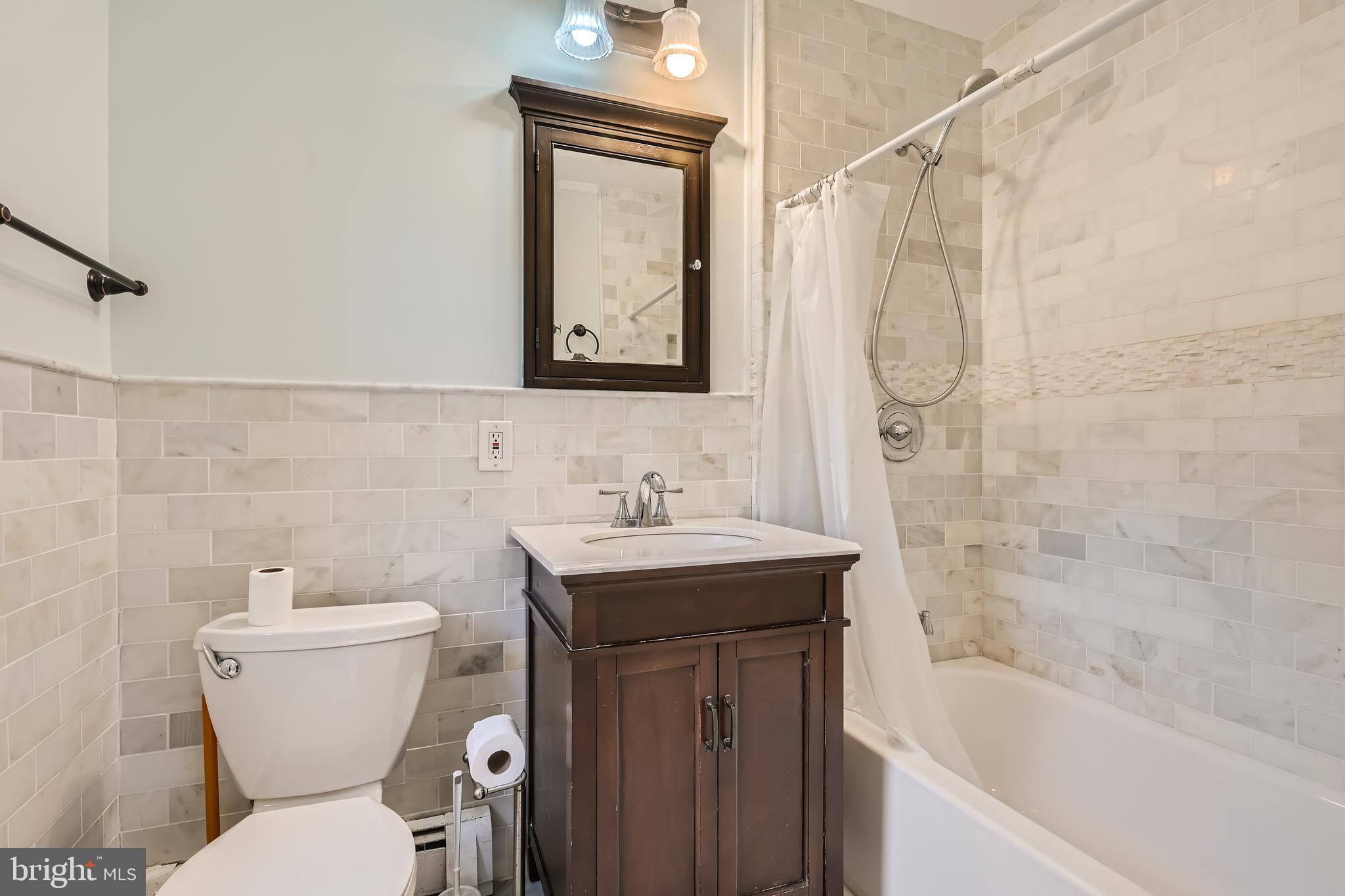 23 Greenspring Valley Road Owings Mills, MD 21117 - Photo 17 of 28 a bathroom with a sink toilet and shower