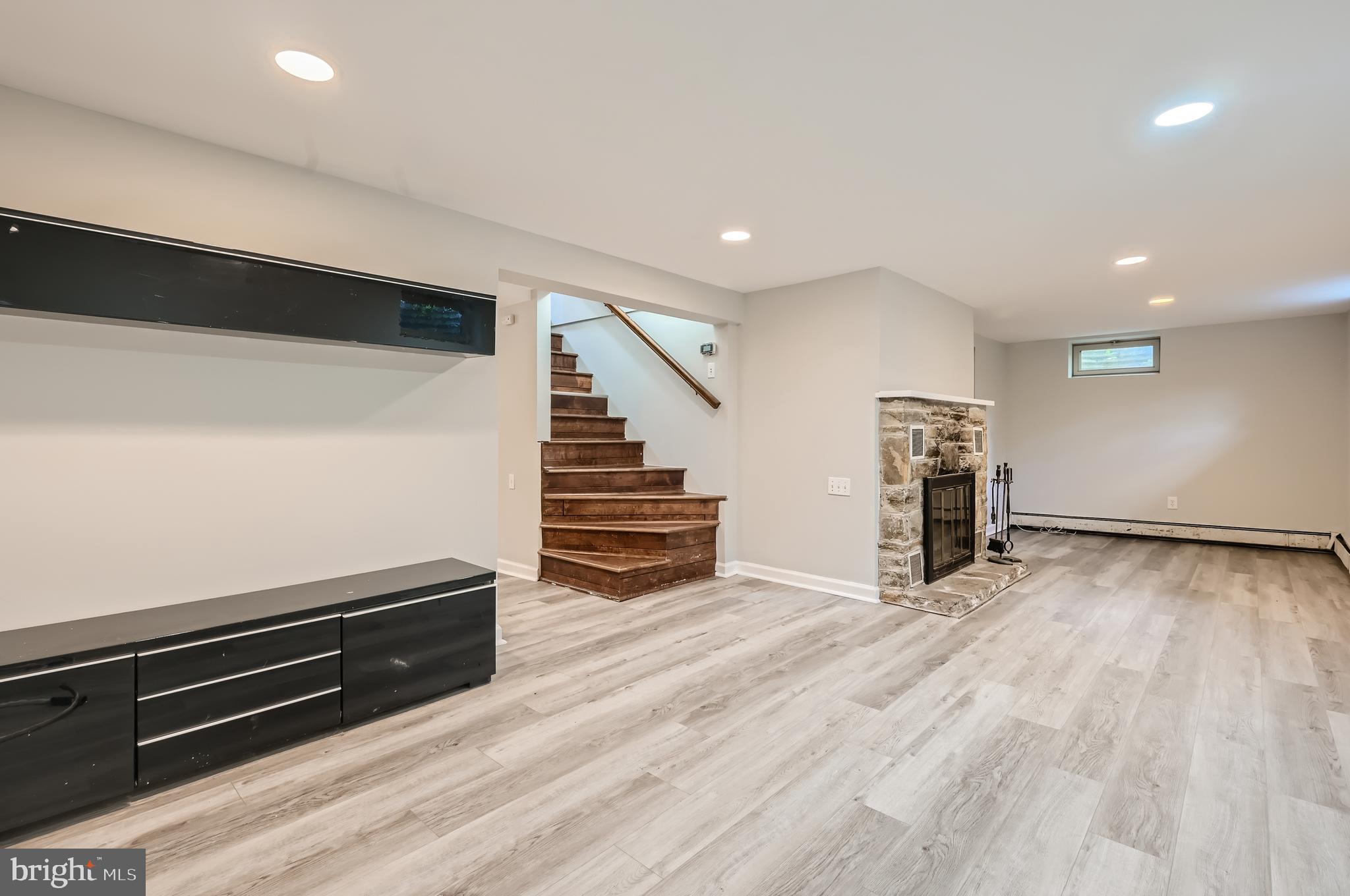 23 Greenspring Valley Road Owings Mills, MD 21117 - Photo 19 of 28 an empty room with wooden floor and stairs